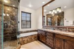 Beautiful classy bathroom with walk-in shower and separate bathtub